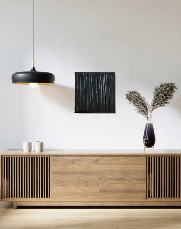 Textured Art Nighttime Sheets black framed on a white wall over a wooden livingroom board